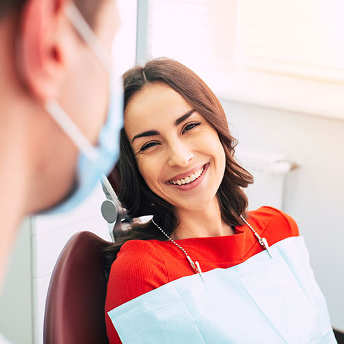 smiling-woman-at-the-dentist woman at the dentist
